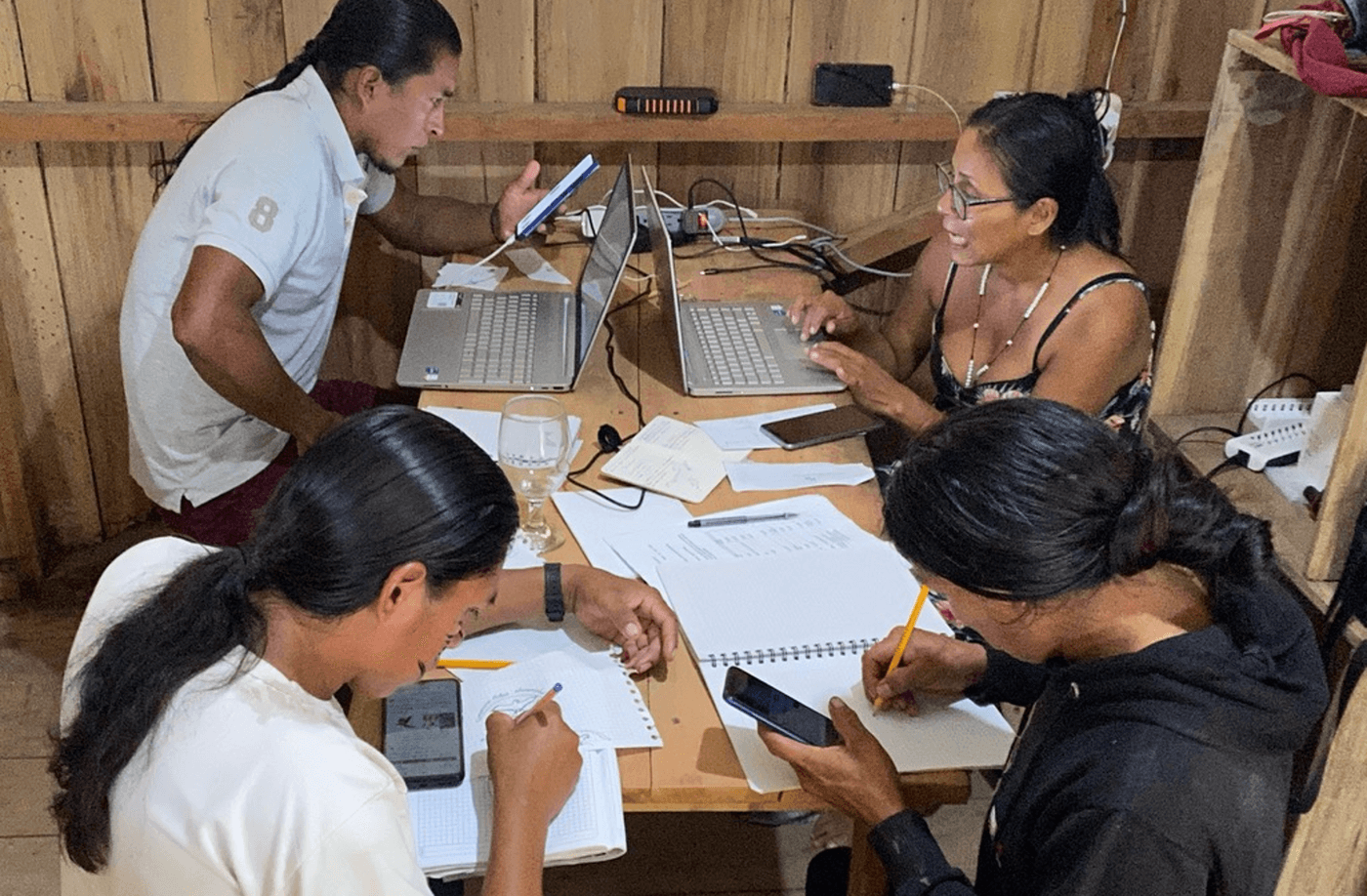 Amazon community monitoring team in Sharamentsa reviewing their data collection process